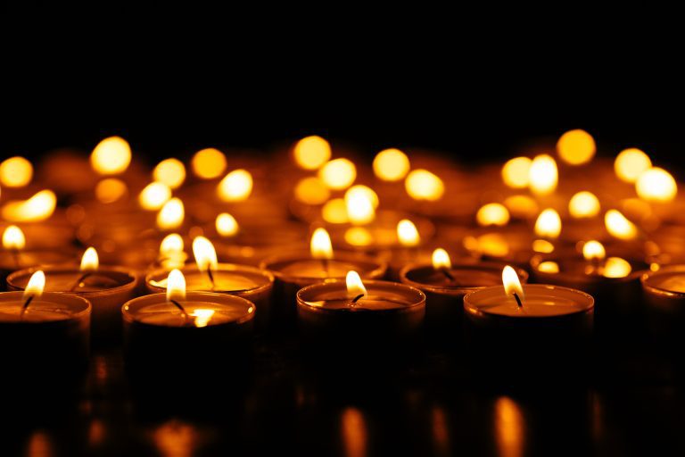 Candles. Set of lighting candles in dark